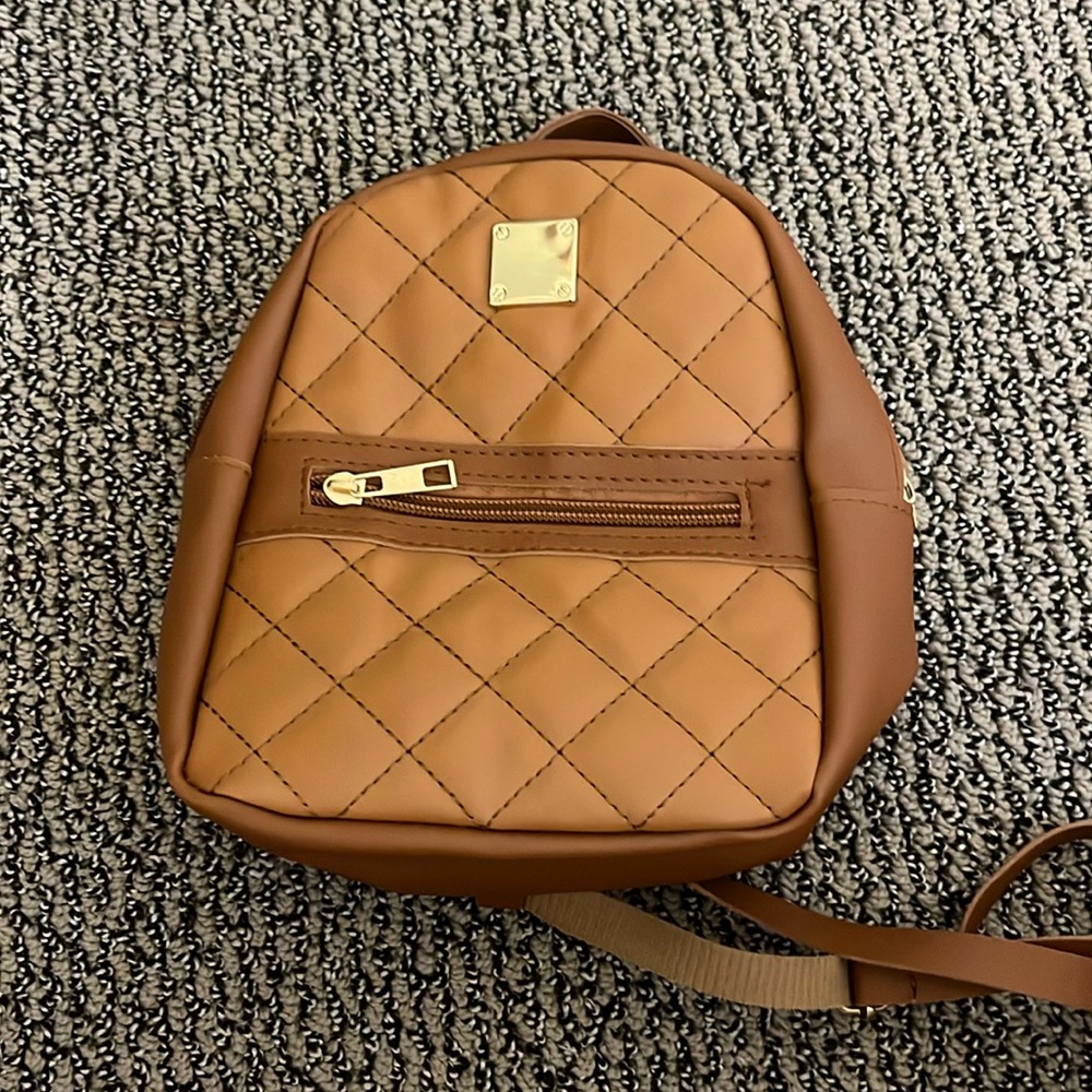 Mini bag with adjustable straps leather and brown